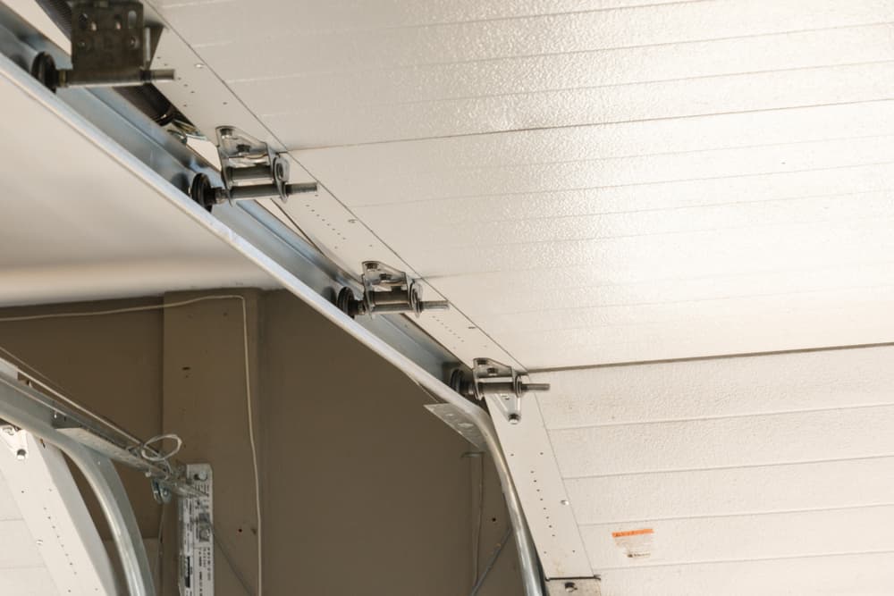 Broken garage door repair for tracks rollers and cables in Calgary